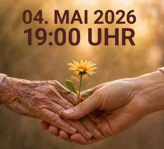 Zwei Hände halten eine gelbe Blume