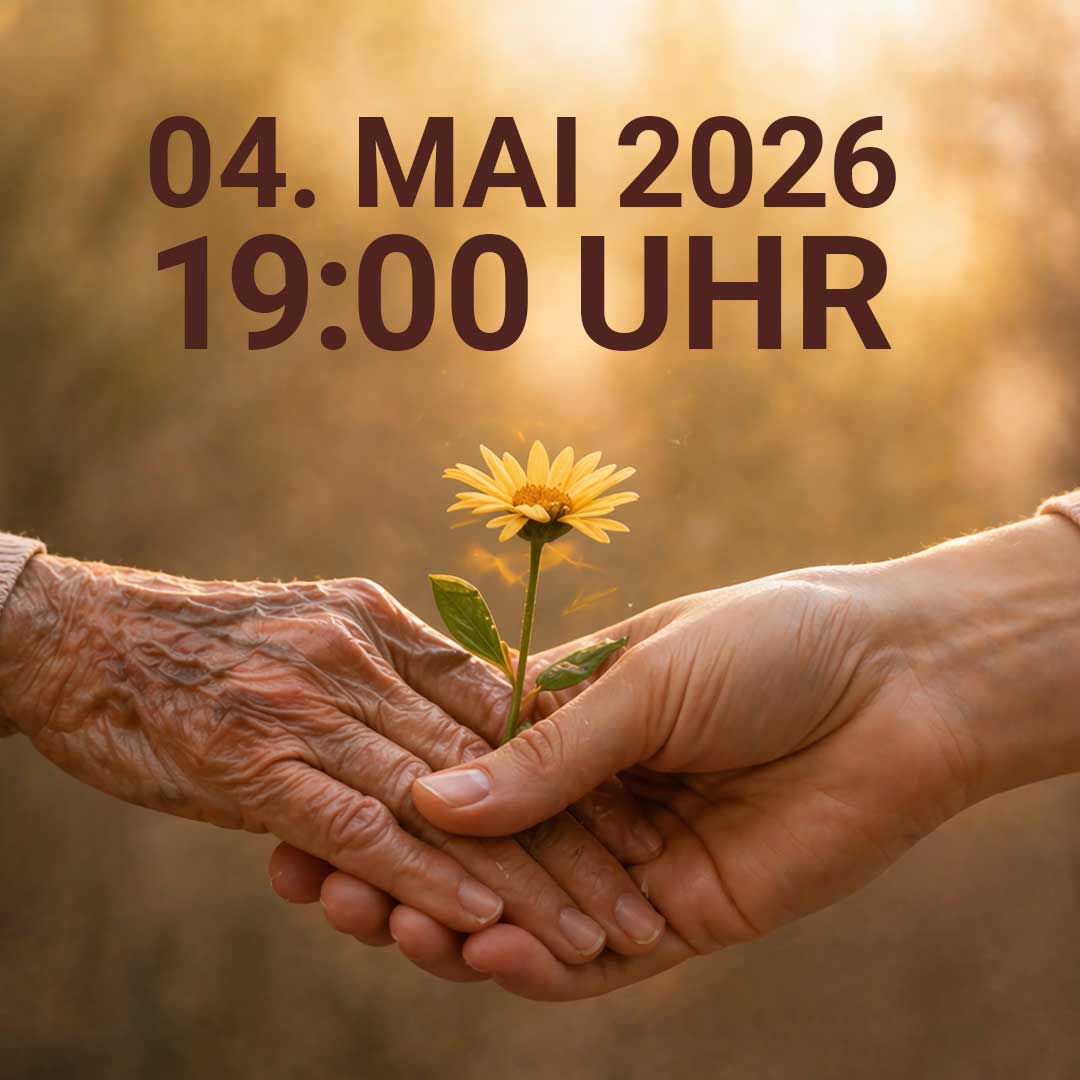 Zwei Hände halten eine gelbe Blume